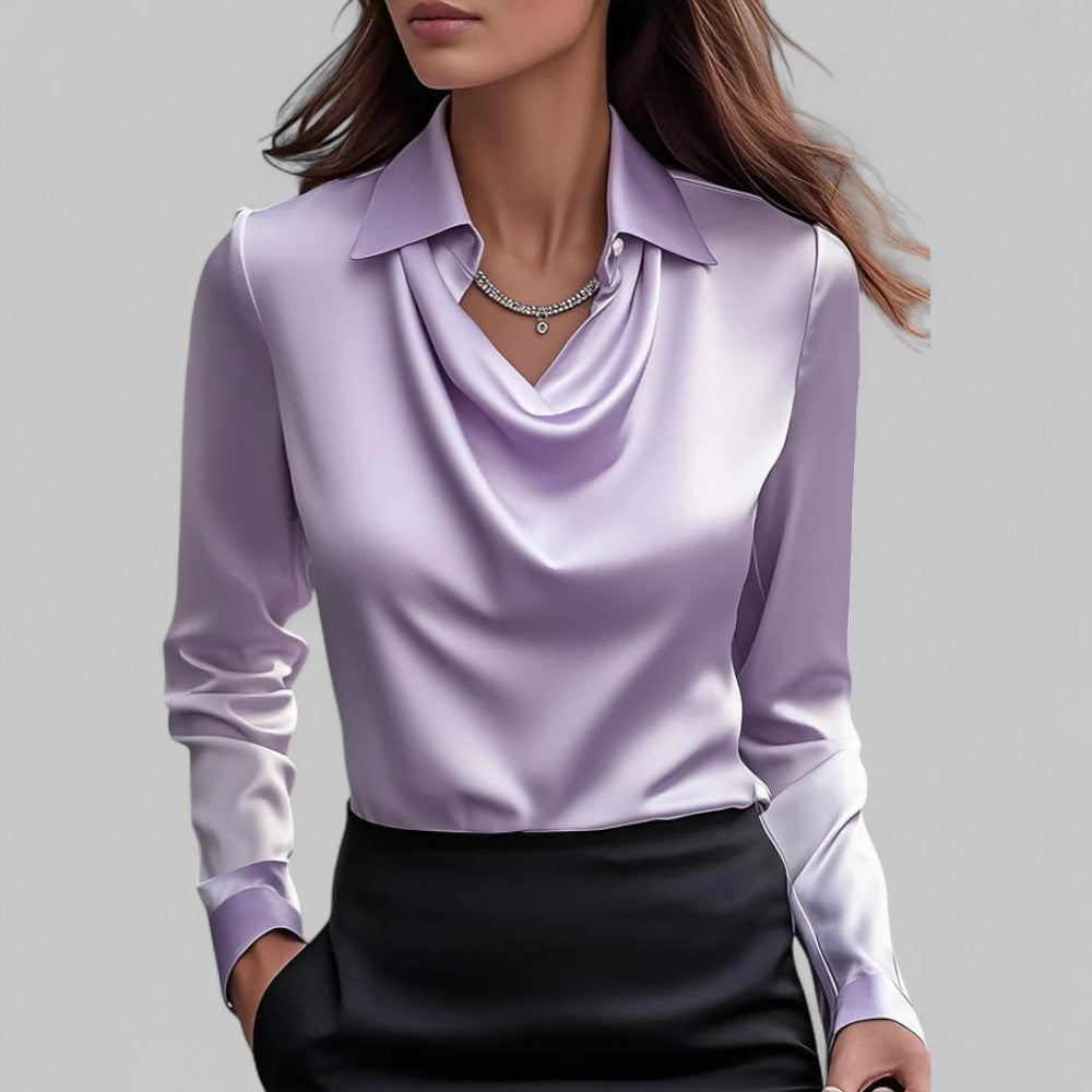 Woman model wearing a refined satin blouse with a smooth silky finish.