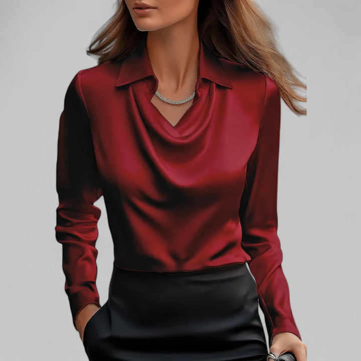 Long sleeve satin blouse styled on a woman model with a plain background.