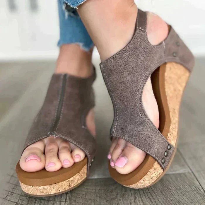 Foot model front angle wedge sandals plain background minimal shadow