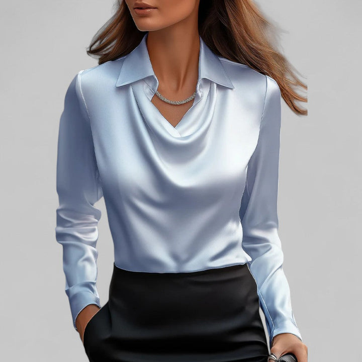Woman model presenting an elegant blouse suitable for office and dinner wear.