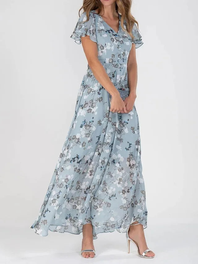 Female model wearing a chic midi dress against a plain background.