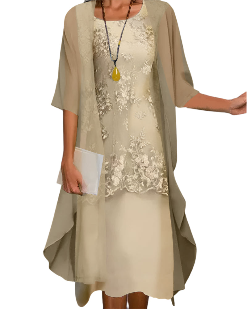 Woman wearing sheer sleeve midi dress on plain gray background.