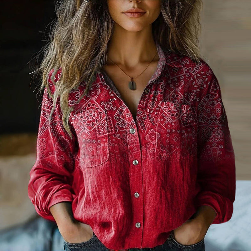 Woman model wearing a printed button front long sleeve top against a plain background