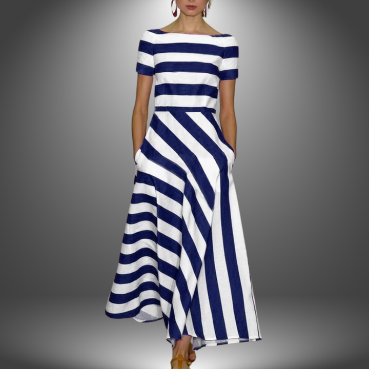Woman model posing in a striped boat neck midi dress on a clean background.