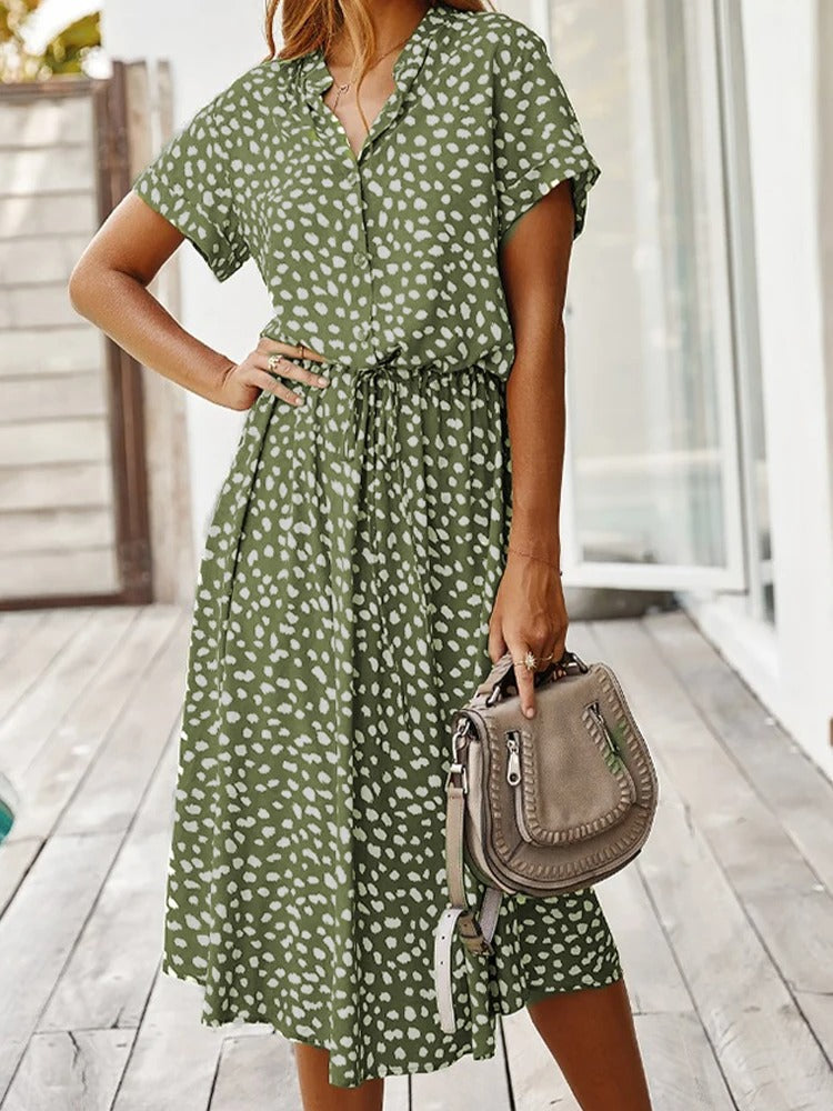 Front view of green printed midi dress outdoors