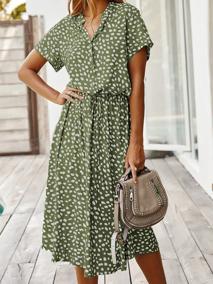 Front view of green printed midi dress outdoors