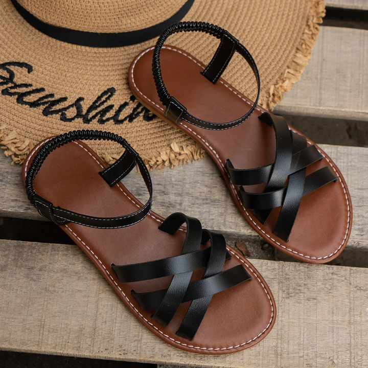 Minimalist shot of sandals on foot model background studio