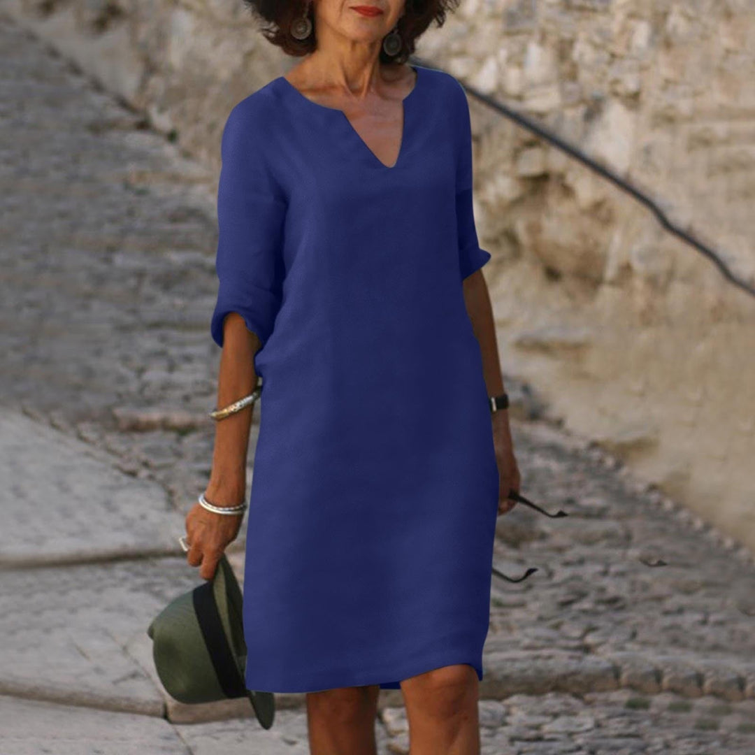 Model wearing a true-to-size casual midi dress on a plain background.