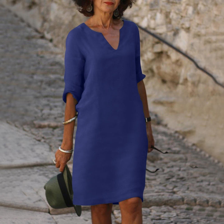 Model wearing a true-to-size casual midi dress on a plain background.