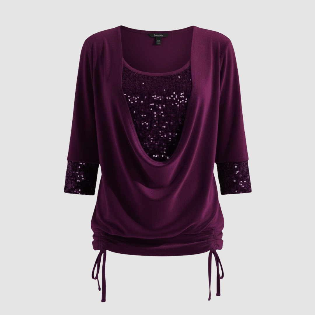 Draped long sleeve blouse with soft sparkle detail.