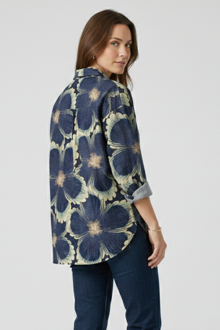 Back view woman in button down floral blouse