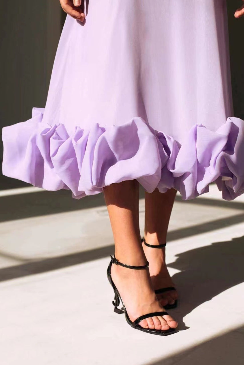Flowing ruffle bottom of a dress
