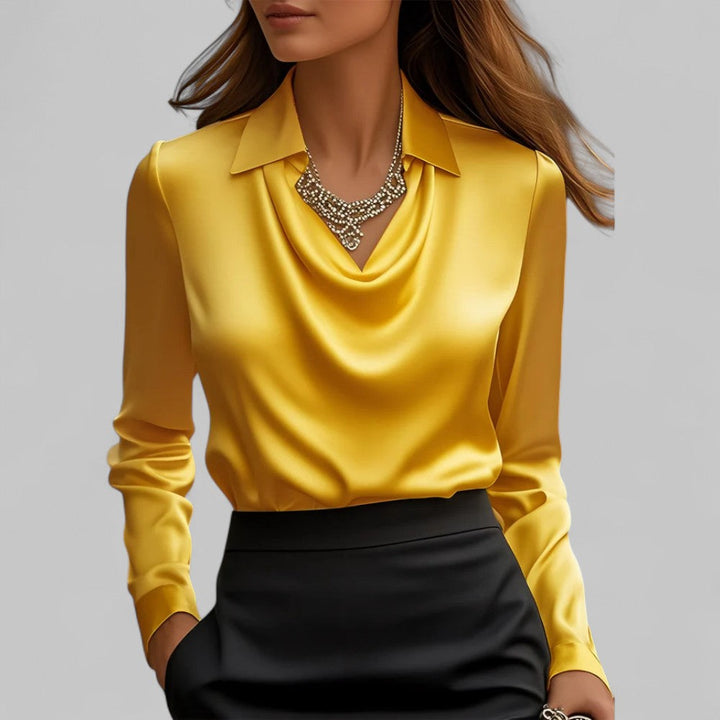 Woman model wearing a polished long sleeve blouse with graceful draped detail