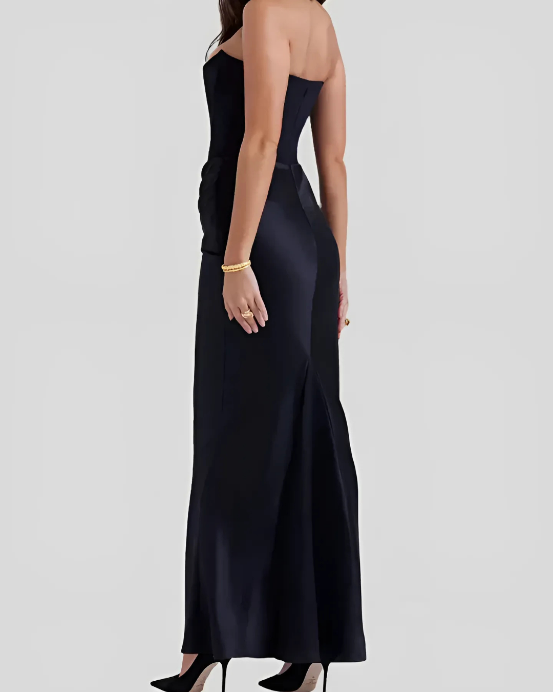 Model slight turn highlighting soft draped lines plain background