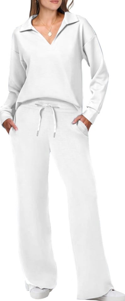 Female model wearing a smooth casual two piece outfit on a plain background.