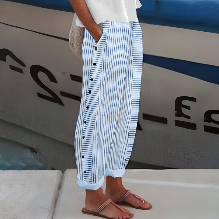 Blue striped cropped pants with side buttons outdoors