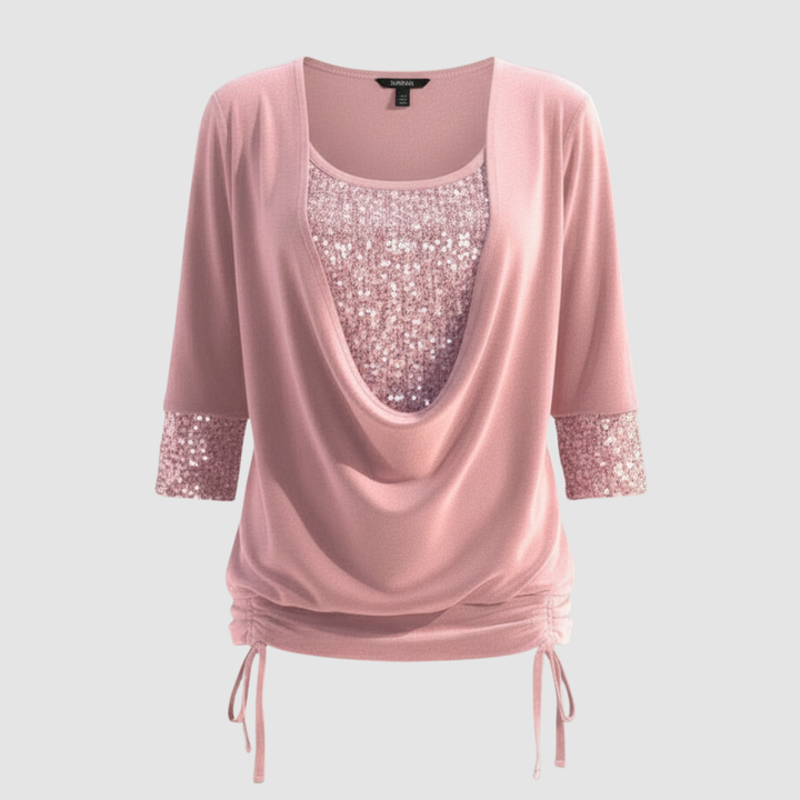 Shiny long sleeve blouse on a plain background.