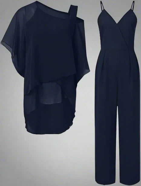 Flowing layered top and relaxed trousers on a plain background.
