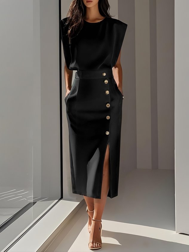  Woman in a graceful midi dress with a round neckline on a plain background.