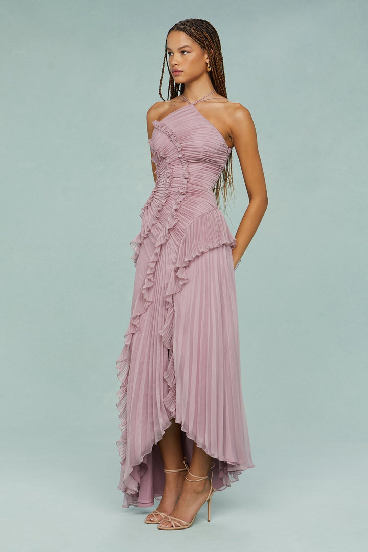 Female model showcasing a dressy celebration look against a plain background.