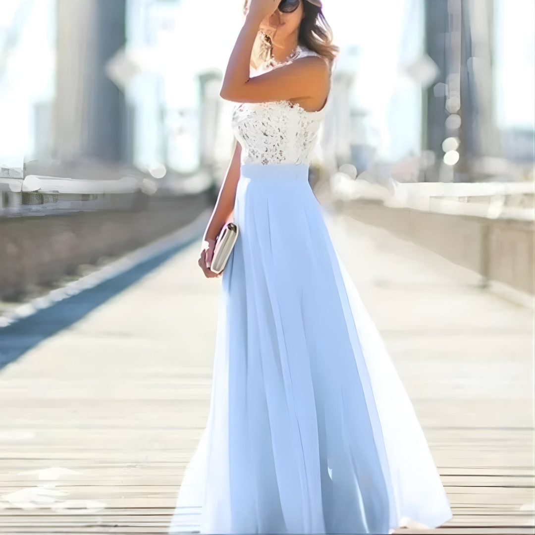 Woman close up embellished maxi dress details blurry bridge background