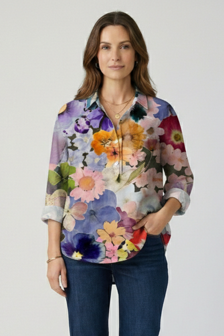 Model wearing multicolor floral blouse detail fabric print close shot