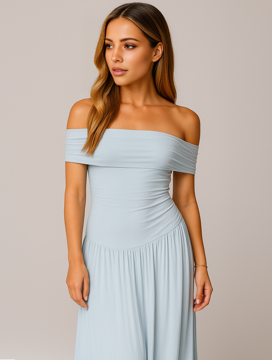 Woman styled in a long pleated occasion dress with soft mo