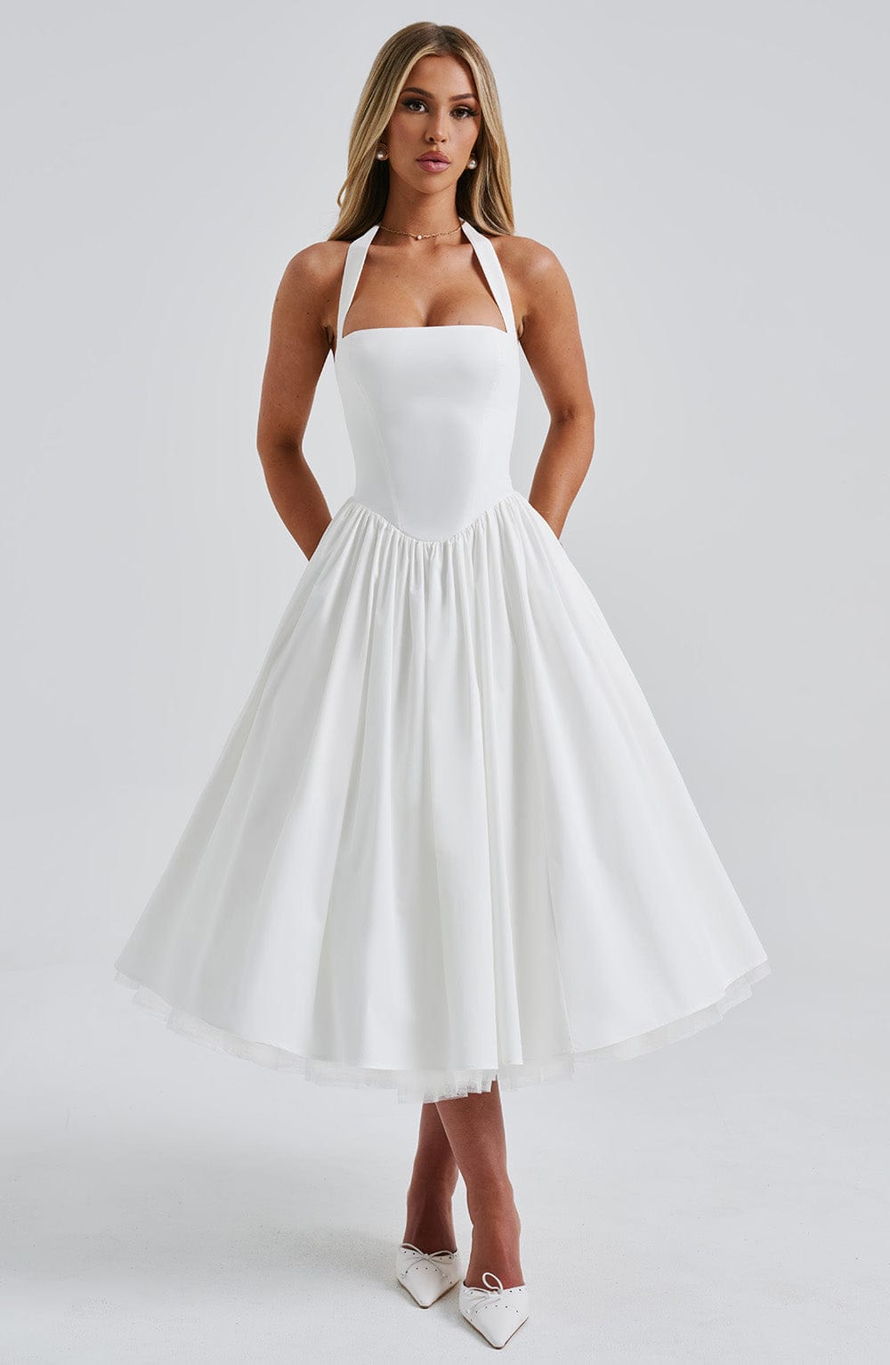 Woman showing side profile in elegant summer midi dress, clean front view