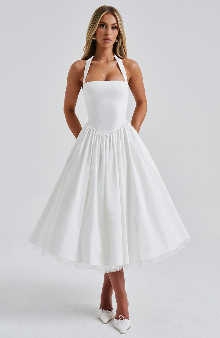 Woman showing side profile in elegant summer midi dress, clean front view