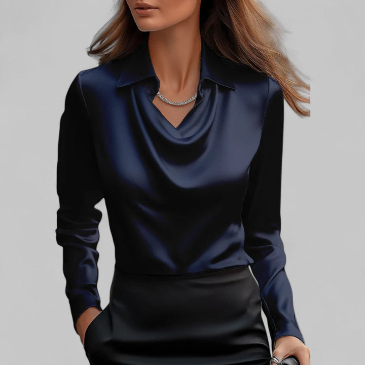 Elegant satin top displayed on a woman model against a clean background.