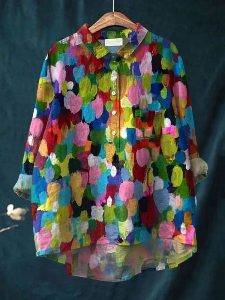 Colorful women’s summer blouse with artistic floral pattern.
