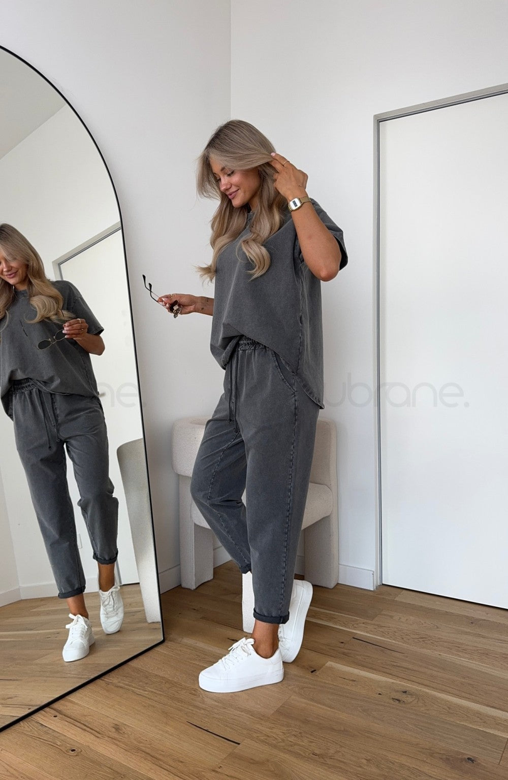Women’s two piece outfit with adjustable waist pants.