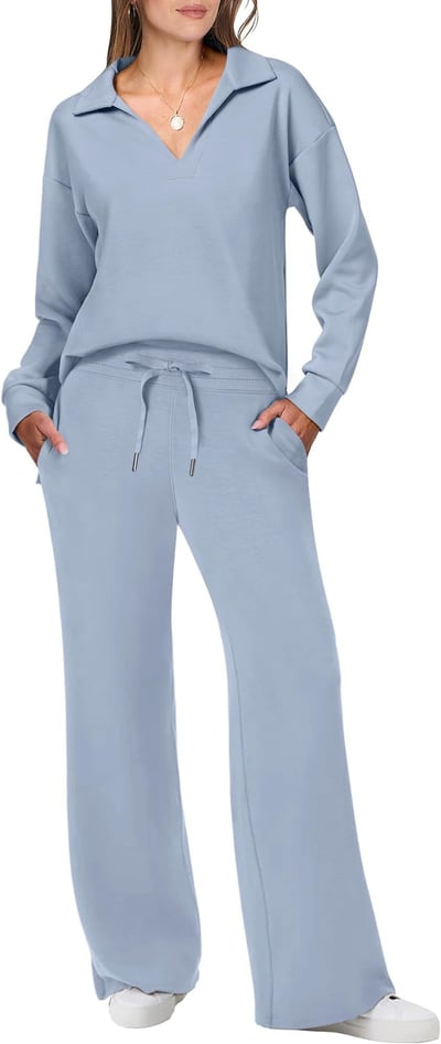 Female model styled in a relaxed jogging suit set against a plain background.