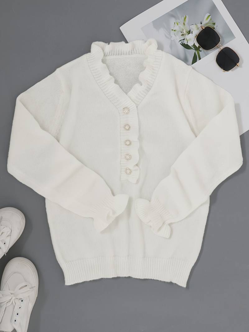 Feminine ruffle blouse shown against a plain background with soft neckline accents, front view