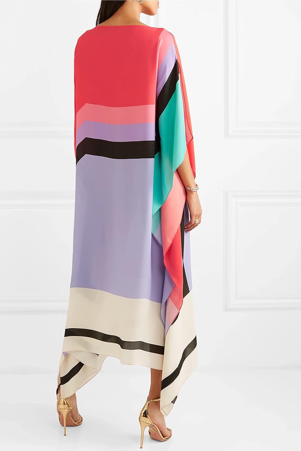 Asymmetric hem kaftan shown on a model in a clean background setting, back view