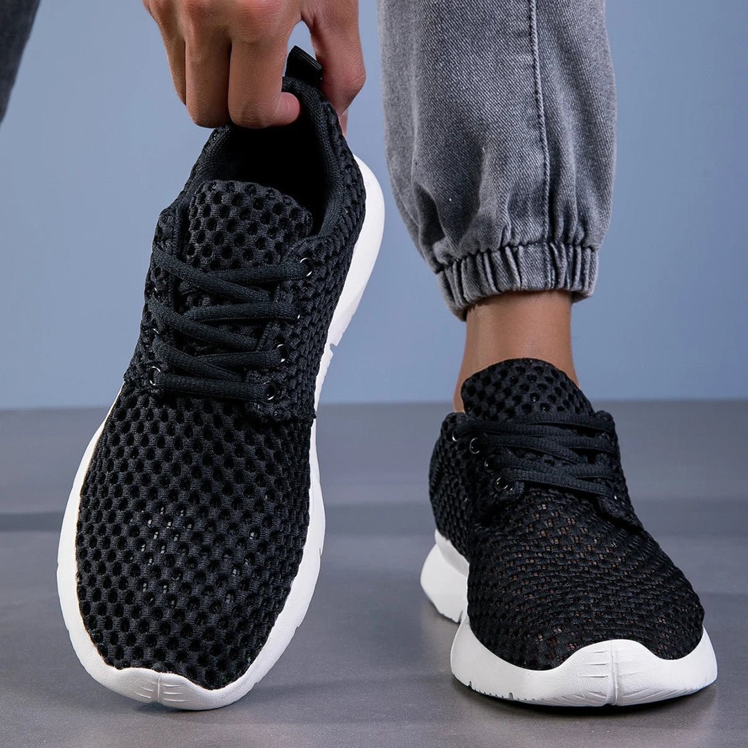 Front side angle of white mesh footwear