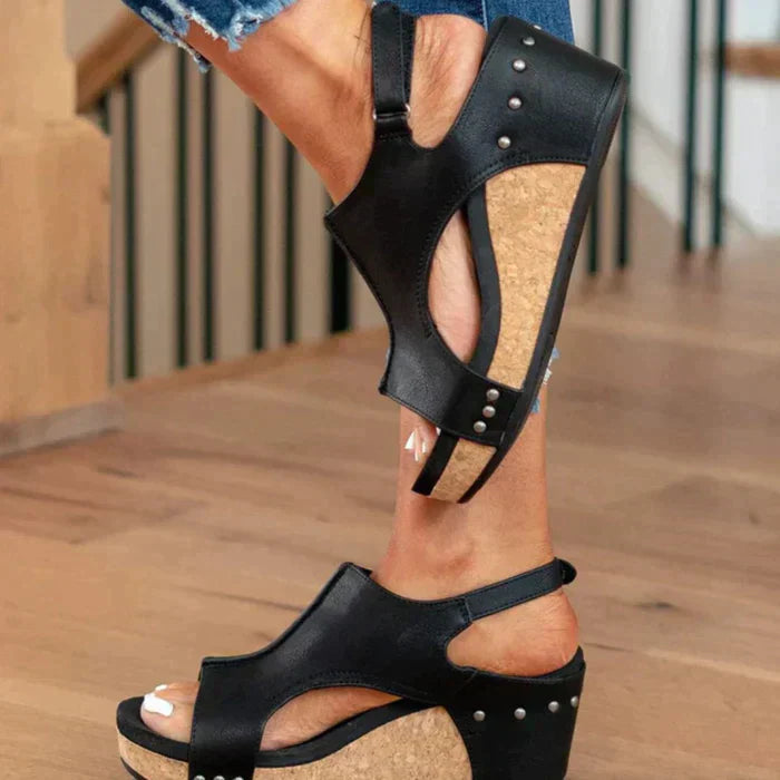 Foot model side angle wedge sandals plain background clean setup