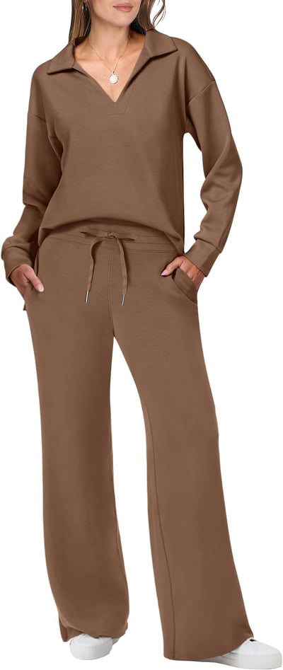 Model in a fitted casual outfit with matching leggings on a plain background.