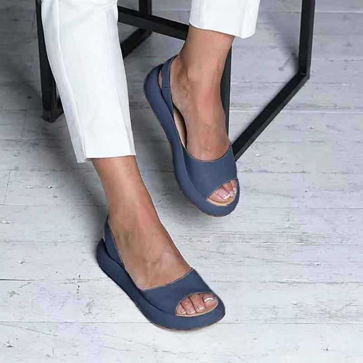 Angled side shot of flats on model foot white background