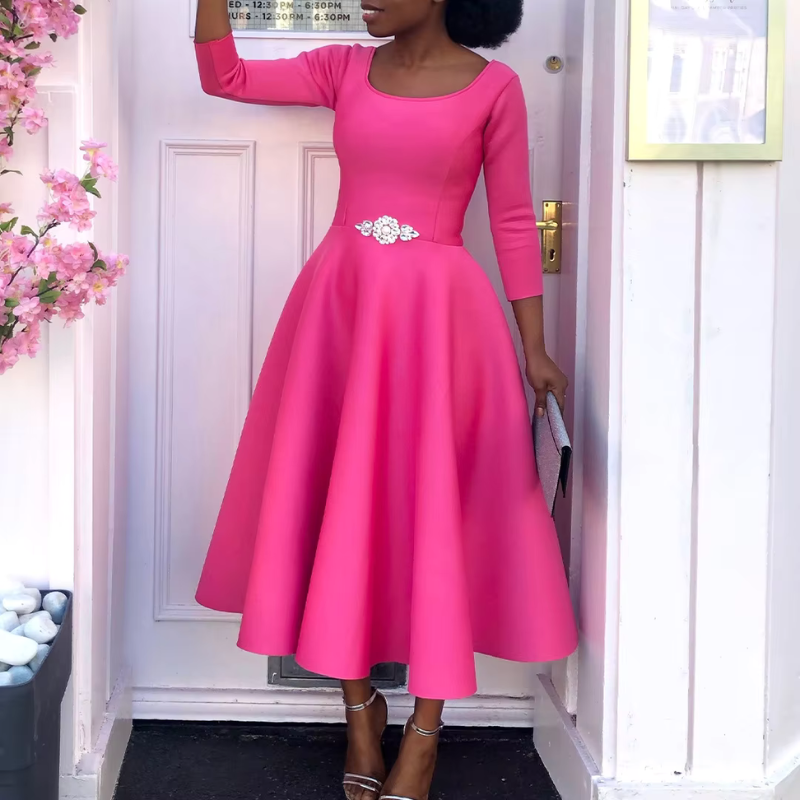 Female model displaying back angle of elegant party dress beautifully.