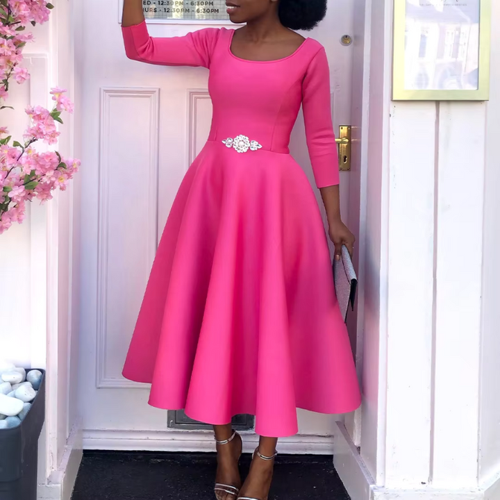 Female model displaying back angle of elegant party dress beautifully.