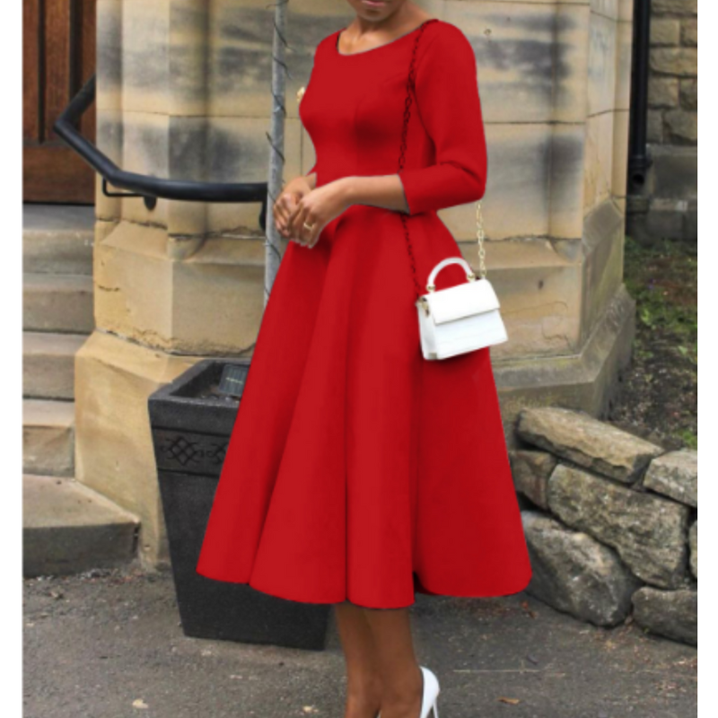 Woman wearing chic midi outfit captured from side profile angle.