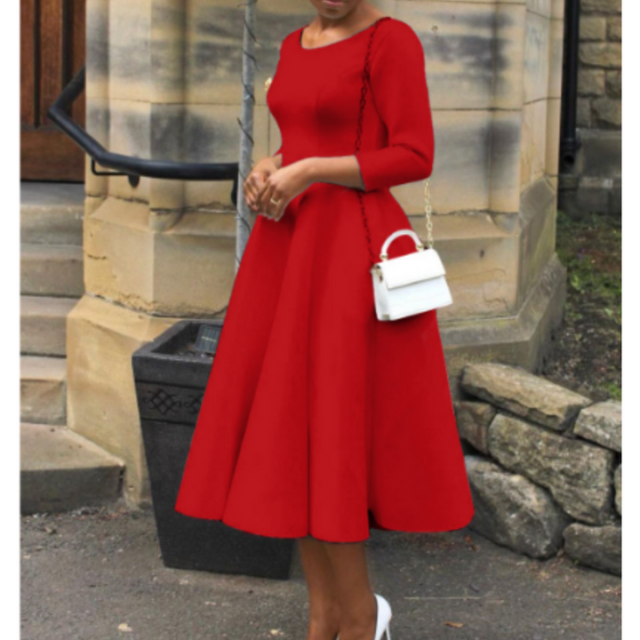 Woman wearing chic midi outfit captured from side profile angle.