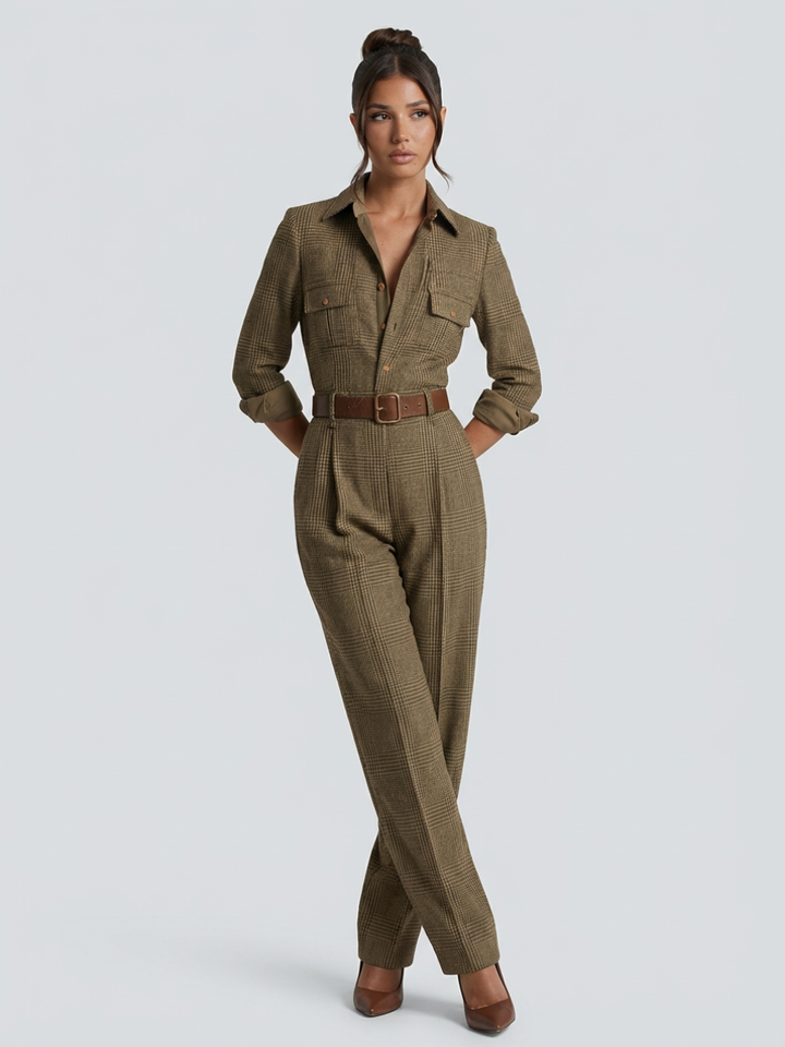 Woman in a tailored beige jumpsuit with wide-leg fit on a plain background.