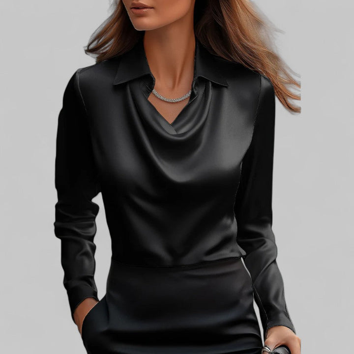 Woman model in a chic satin blouse designed for refined occasions.