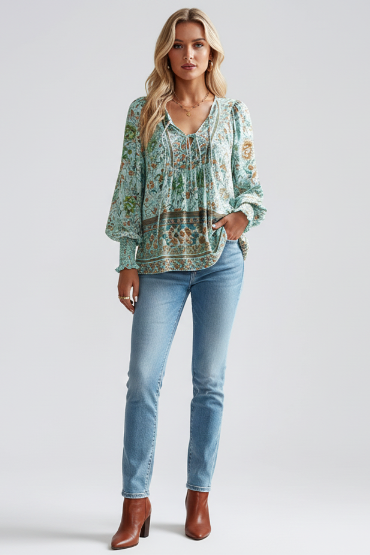 Green printed blouse worn with fitted light jeans
