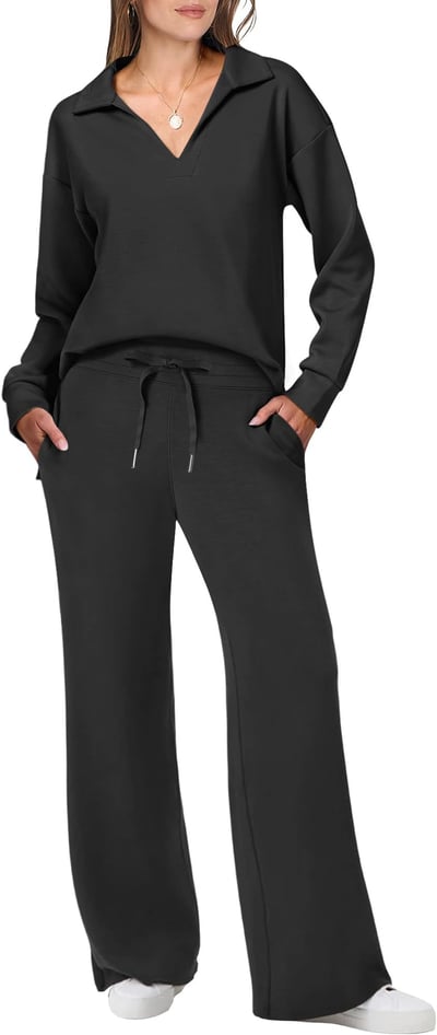 Model wearing a clean line jogging suit set on a plain background.