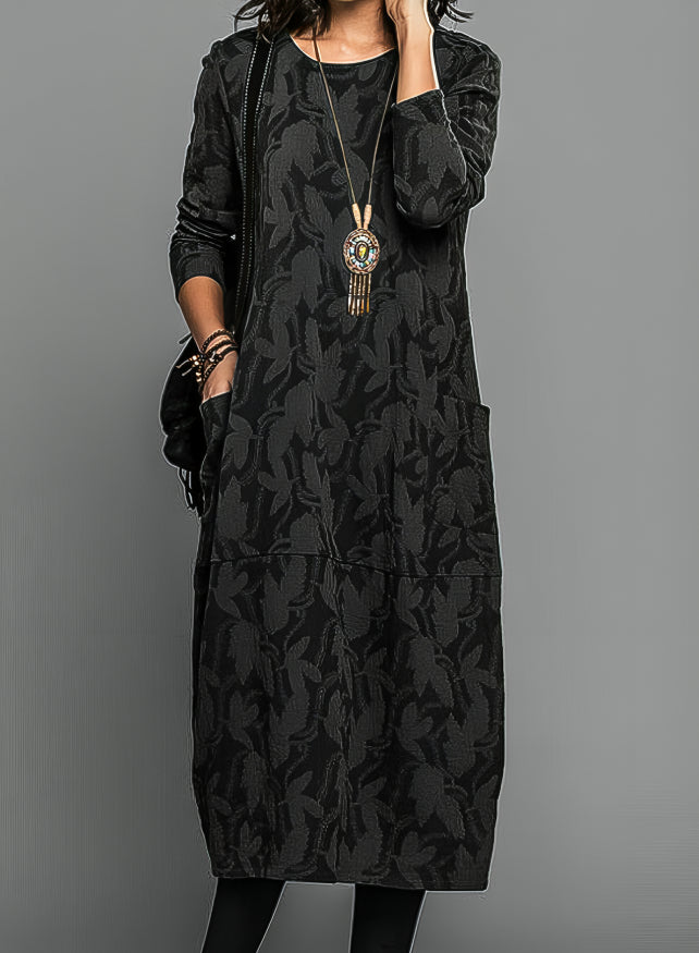 Female model in front view printed midi dress, gray plain background.