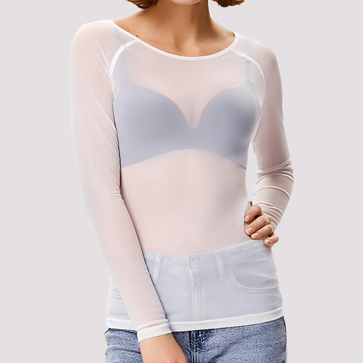 Woman wearing a stylish transparent long sleeve shirt on a plain background.