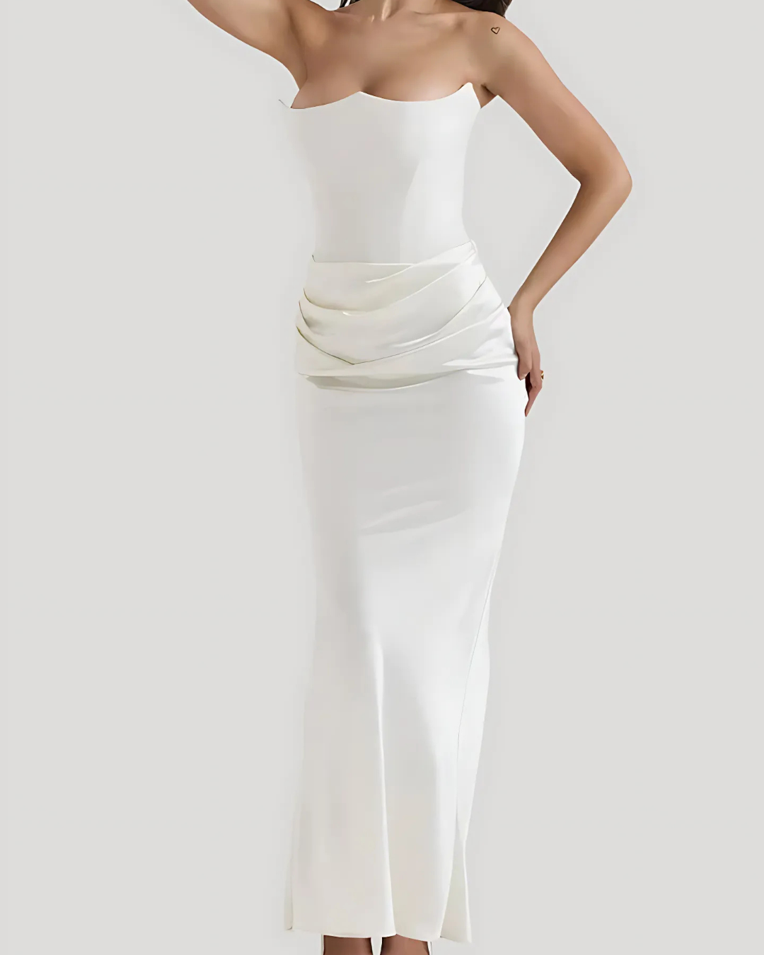 Model elegant pose showing refined long dress shape plain background
